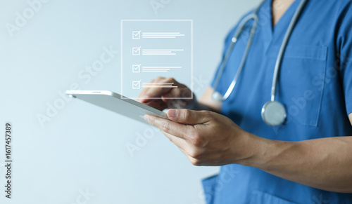 Fotografie close up young general practitioner hold digital tablet for checking box on medi