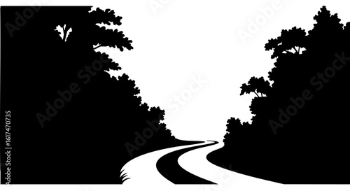 A winding road leading through a silhouetted forest.