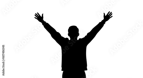 Silhouette of a person with arms raised high, exuding freedom.