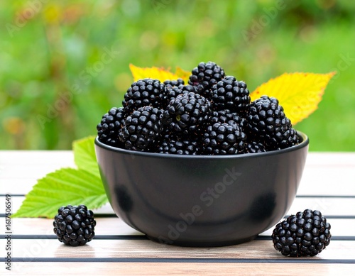 A Black Bowl Filled with Fresh Blackberries
