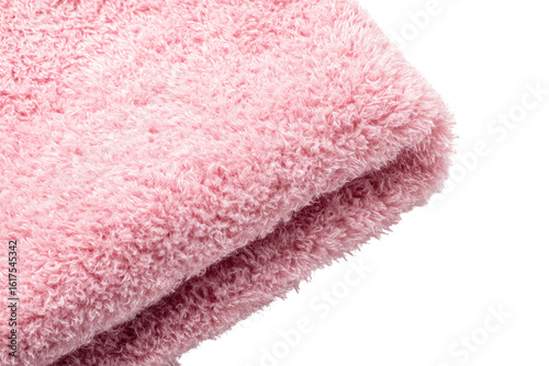 Close-up of a folded, light-pink, fluffy towel.  Soft, textured surface.  Folded edge visible