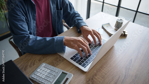 Business man saving money accountant financial analyst and auditor working and laptop for calculating