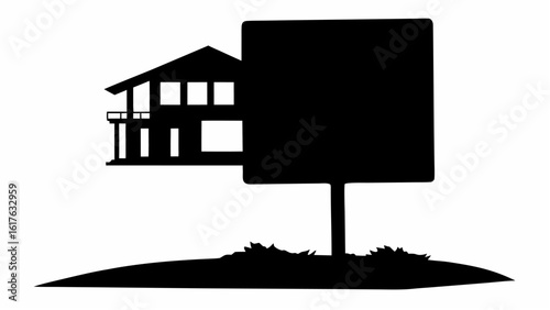 Silhouette of a two story house with a balcony next to a blank sign on a hill with grass patch