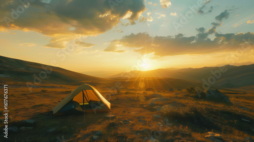 Tent in the mountains at sunset, A tourist tent camp in the mountains at sunset/Sunrise, Camping in the mountains