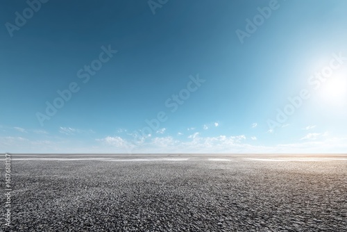 Empty asphalt expanse under a vibrant blue sky