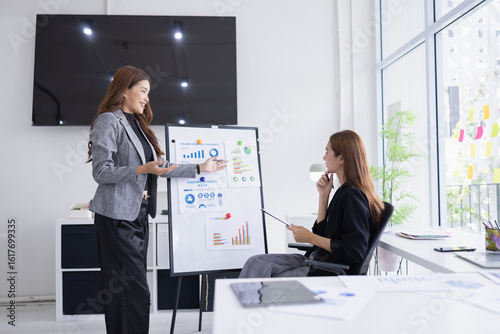 businesswoman working together with marketing strategy analysis at meeting room.