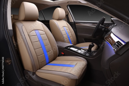 Beige and blue car seat covers installed in a vehicle's interior