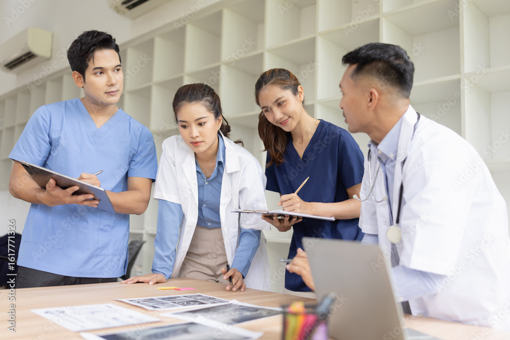 Medical team brainstorming having a meeting in conference room at hospital, Medical technology and health care concept. Medical team brainstorming having a meeting in conference room at hospital, Medical technology and health care concept.