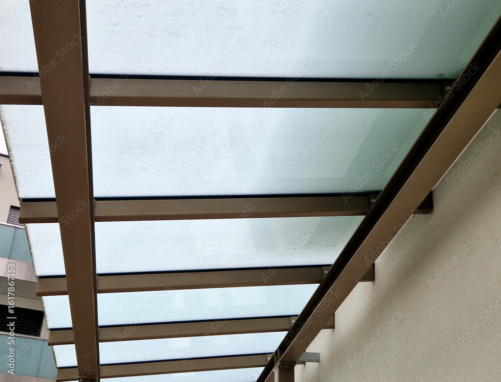 Obraz premium strut, suspended glass roof above the building entrance. bus station, railway station. cable wind braces. aluminum construction with windows above pergola galvanized steel frame