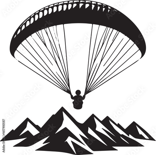 Black silhouette paraglider flying over jagged mountains paragliding black and white