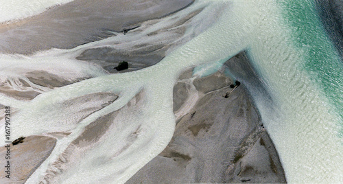 Iconic Italian river Tagliamento, Friuli, Carnia, Italy. Aerial view of the braided riverbed with pale water flowing through gravel banks.