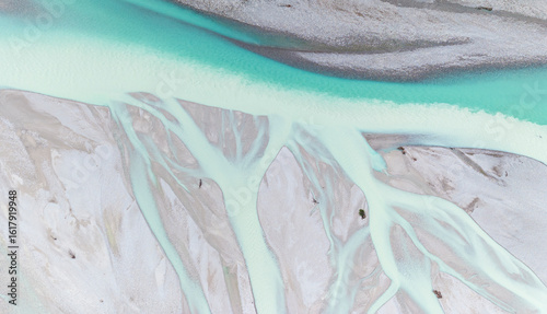 Iconic Italian river Tagliamento, Friuli, Carnia, Italy. Aerial view shows braided river channels with turquoise water flowing through gravel beds.