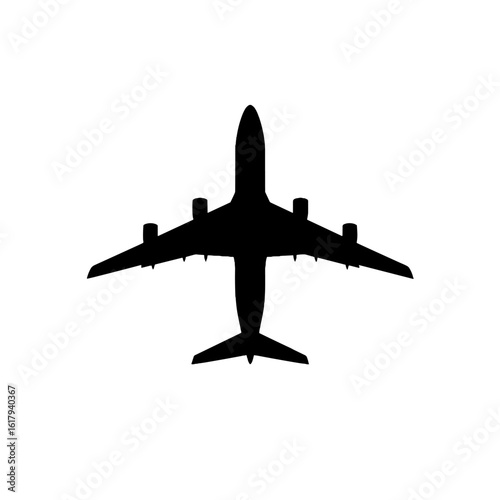 A black silhouette of an airplane viewed from above.