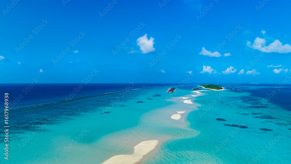 Fototapeta premium Aerial view in the island with white sand beach as coastline in summer Maldives