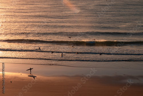 Photos Silhouettes and shadows of early morning surfers at first light at Yamba Main Be