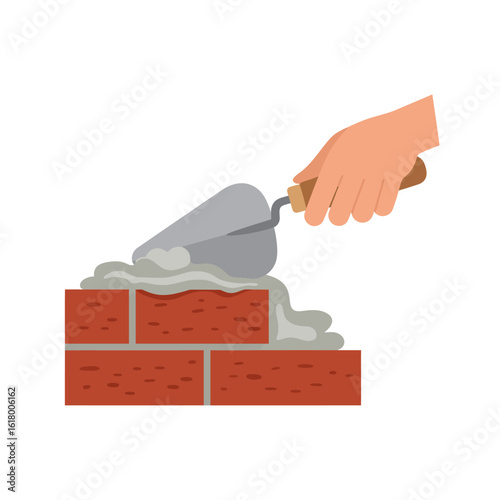 A hand uses a trowel to apply mortar between red bricks, illustrating the process of building a wall, on a clean white background.