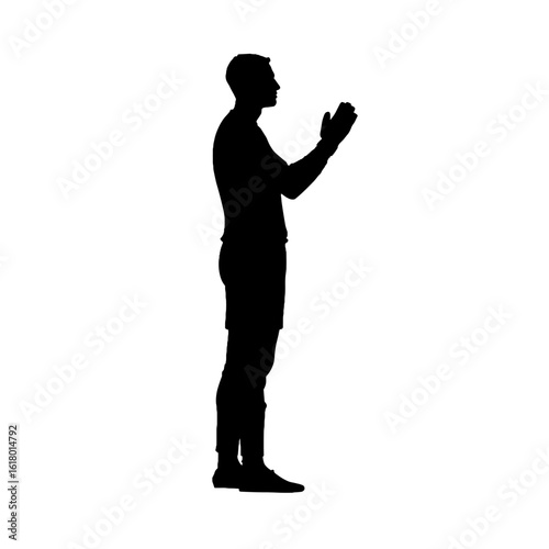 Silhouette of a man in prayer position.