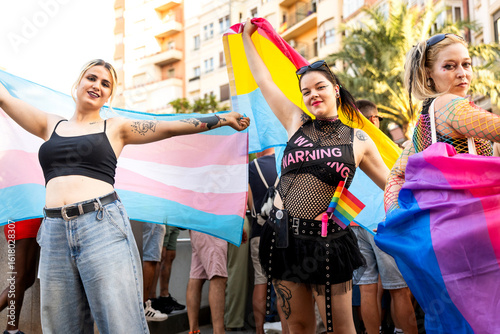 Tableau sur toile Activists holding transgender and intersex flags at pride parade