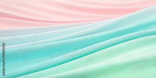 Soft pastel fabric flowing gently in beautiful waves creates a serene, elegant background texture