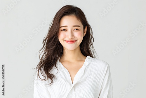 Headshot portrait of a beautiful young Asian woman with a friendly smile on a white background generated by AI