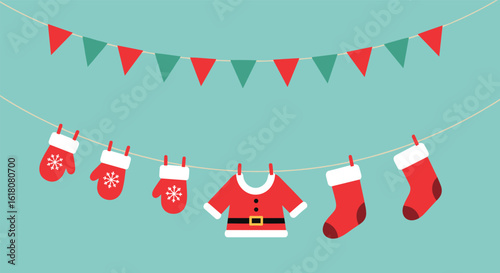 Festive holiday decoration with hanging christmas mittens stockings and santa claus suit on a clothesline
