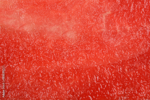 Fotografie A macro shot reveals the vibrant red and textured flesh of a ripe watermelon