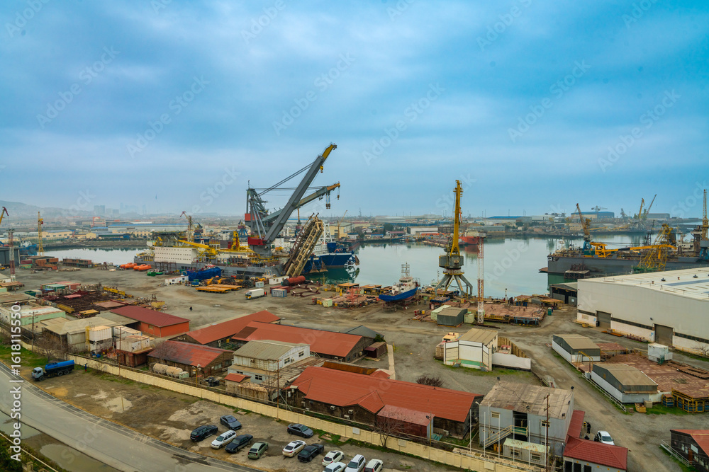 Fototapeta premium Wide image of the shipping dock at Baku with lots of warehouses around