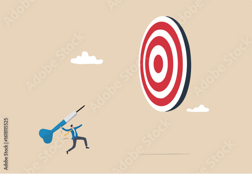 Aiming for big goal, challenge to achieve target, success or accuracy, ambition or determination to reach business target concept, businessman throwing huge dart, aiming to hit dartboard bullseye. 