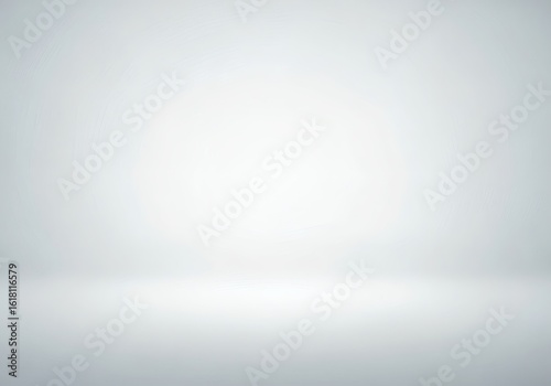 A blank bright white and grey studio backdrop with subtle lighting