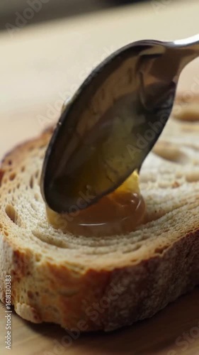 Cinematic 4K UHD footage of golden honey pouring in slow motion and real time — from spoon, jar, and honeycomb. Perfectly viscous, glossy, and natural-looking, this video captures the rich texture and