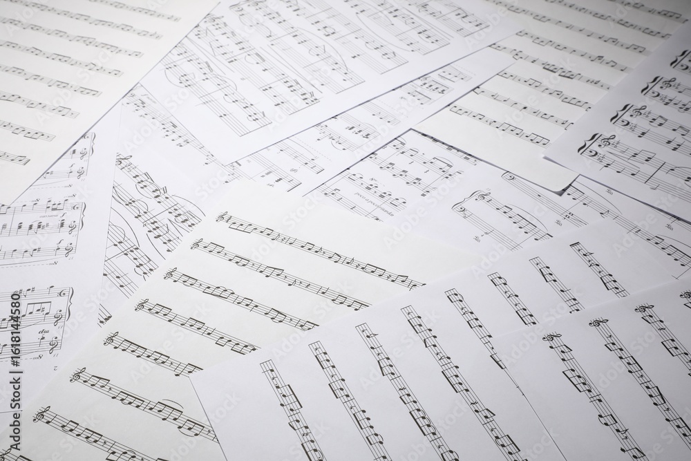Fototapeta premium Sheets with musical notes as background, closeup