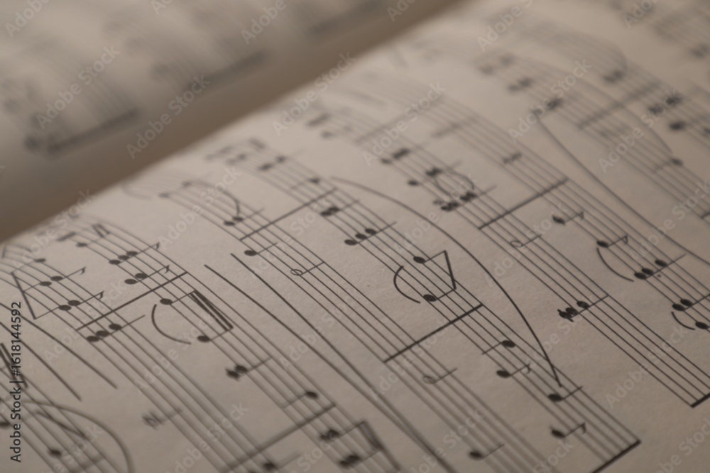 Obraz premium Sheets with musical notes as background, closeup