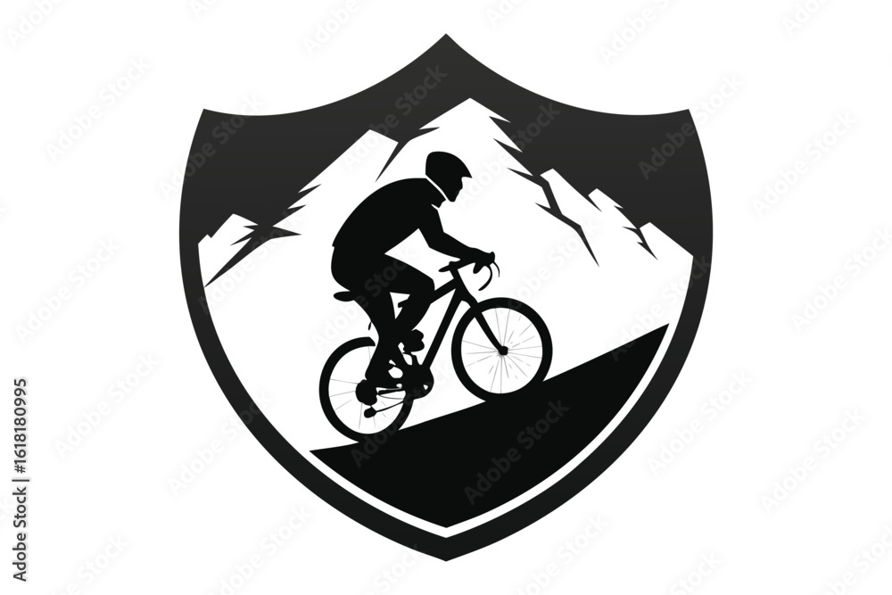 Obraz premium Mountain Biker Silhouette on Hill Inside Shield with Mountains in the Background