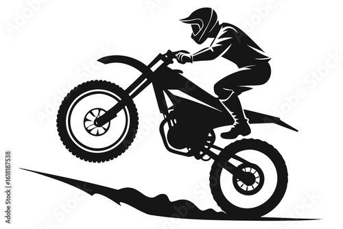 Silhouette of Motocross Rider Performing Wheelie on Motorcycle, Showing Skill and Adventure