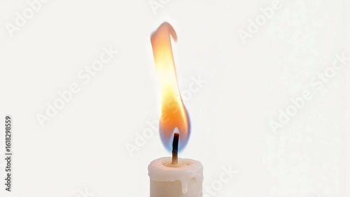 Burning candle flame against a clean white background with soft light and gentle movement