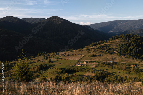 Landscape with mountain slopes on a summer evening