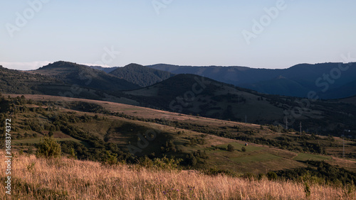 Landscape with mountain slopes on a summer evening