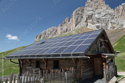 Mountain house with solar panel on the roof