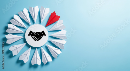 Business leadership teamwork concept with handshake and paper planes for success and innovation idea