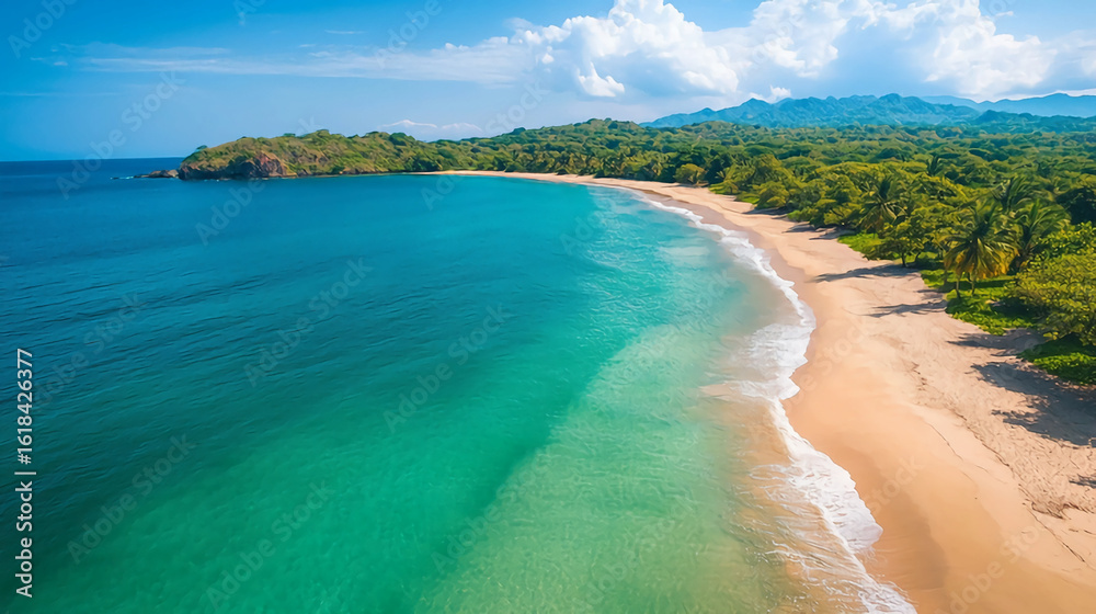 Obraz premium Aerial view of a tropical beach with turquoise water and lush green vegetation along the coastline