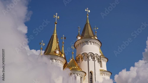 Wallpaper Mural Fantasy castle towers rising above clouds into blue sky with golden domes and crosses - magical peaceful scenery for fairytales or dreams Torontodigital.ca