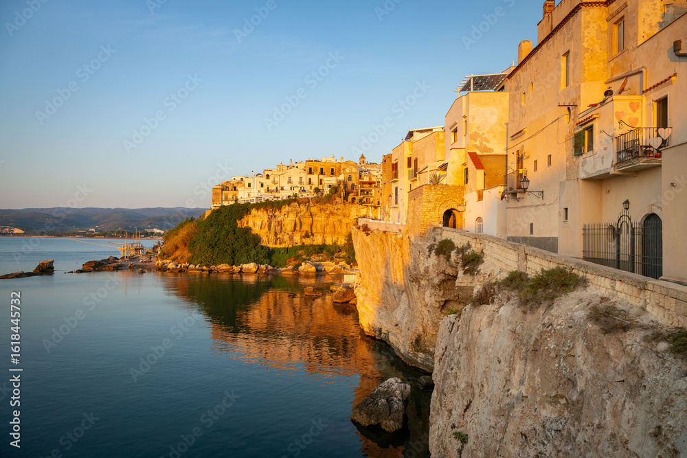 Fototapeta premium Sunlit walls of Vieste, romantic mediterranean town on the Gargano Peninsula, Italy.