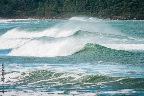 Waves of Praia do Rosa, Brasil. The power of the Atlantic after a huge storm. Big waves hitting the shore