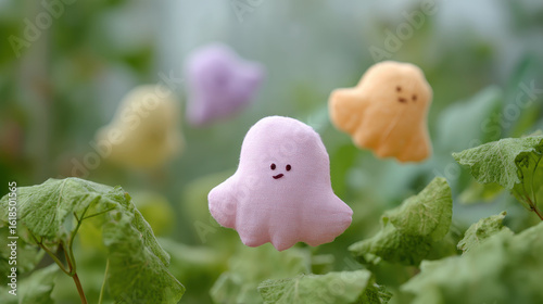 Cute pastel ghost plushies float above green leaves, creating whimsical scene