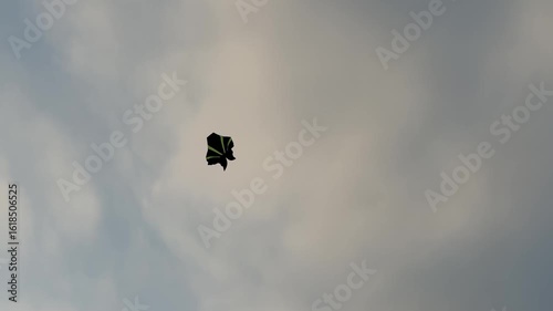 Kite flying on the sunset sky at the Sanur beach in Bali, Indonesia