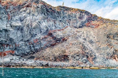 фотографія Mexican coastline with eroded slope and volcanic lava rock formations, cacti on