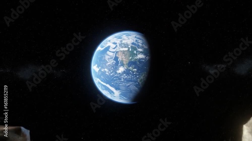 A full moon behind a large tree on a green field under a starry night time sky view