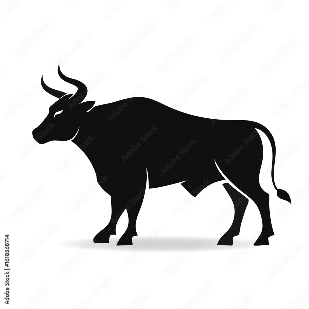 Fototapeta premium Powerful Silhouette of a Black Bull with Majestic Horns Standing Firmly