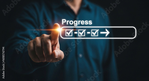 Man tracking project progress with digital checklist, achieving goals efficiently