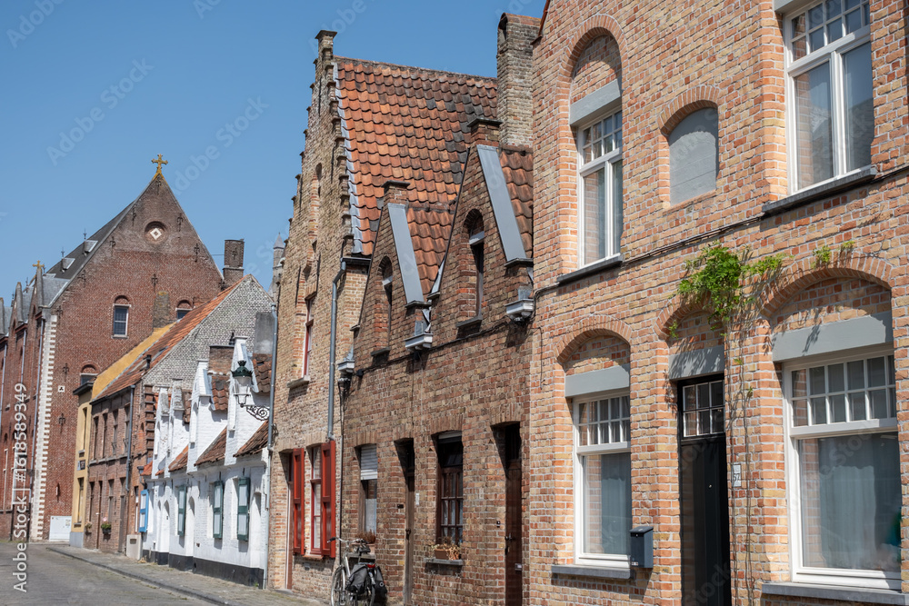 Fototapeta premium Old medieval houses in narrow streets in central Bruges, Flanders, Belgium, tourists destination in Europe
